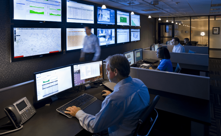 SOC analysts monitoring real-time network threats, preparing for incident response with Cisco CyberOps skills